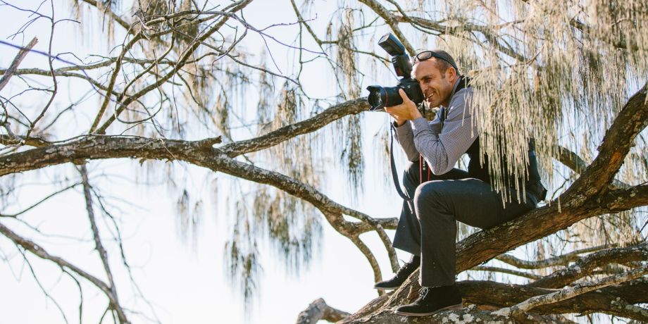 wedding photographer in a tree